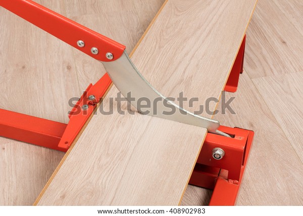 Red Tool Cutting Laminate On Laminate Stock Photo Edit Now