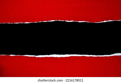 Red torn paper on black background with copy space. - Shutterstock ID 2216178011
