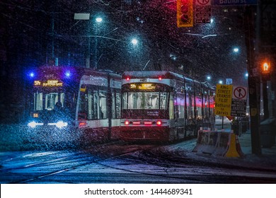 Red Toronto Streetcars in Snow Storm at Night - Powered by Shutterstock