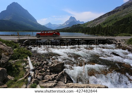 Red Tour Bus Swiftcurrent Lake Glacier National Park waterfall
