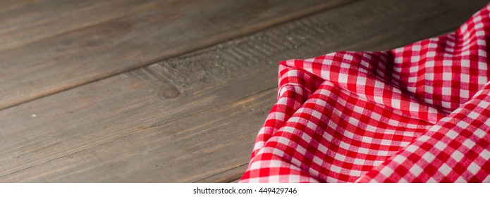 Red Towel Over Wooden Kitchen Table