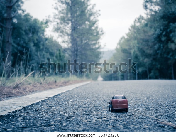 red toy car in journey\
life and travel