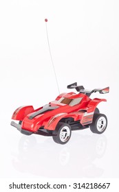 Red Toy Car On White Background.