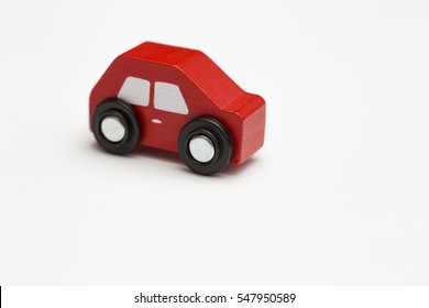 Red Toy Car On A White Background