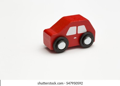 Red Toy Car On A White Backdrop