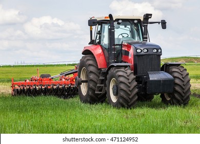 Red Tractor With Large Wheels In The Field