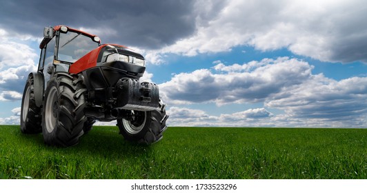 Red Tractor On A Agricultural Field