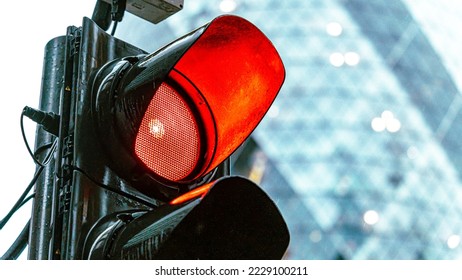 Red traffic light in a busy city center - Powered by Shutterstock