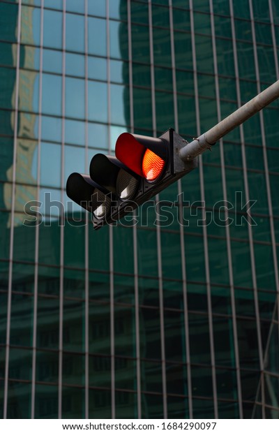 Red traffic light\
downtown the city