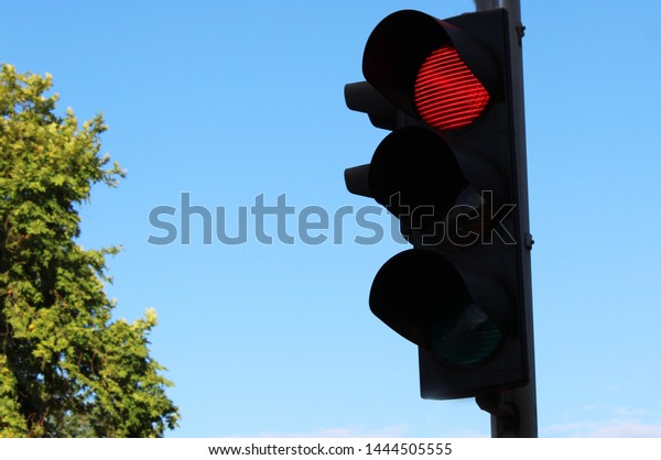 Red traffic light on the\
street 