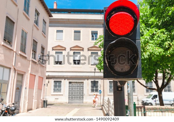 Red traffic light\
at the pedestrian street