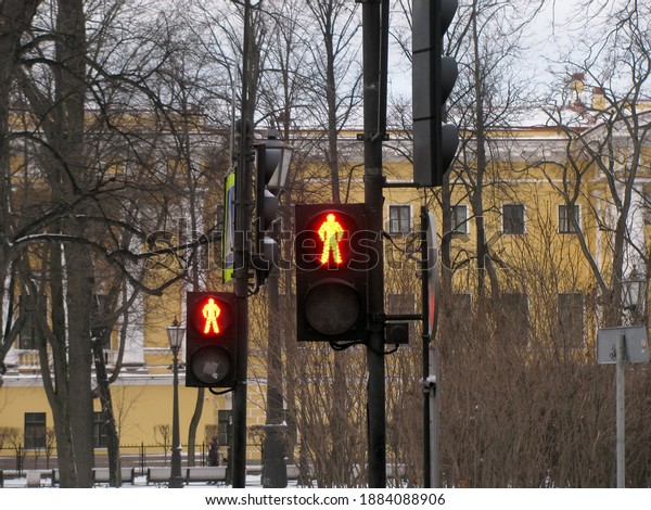 Red\
traffic light for pedestrians. Two traffic\
lights.
