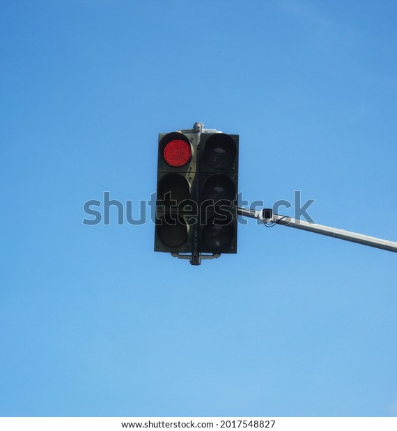 The red traffic light is a sign that the vehicle\
must stop