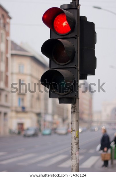 Red traffic light\
in a street of Budapest