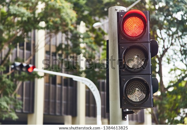 Red traffic\
signal signal. Singapore.\
Close-up.