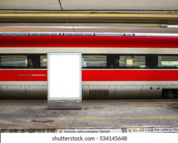 Red Train Carriage Behind A Blank Billboard, With Empty Platform