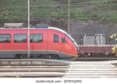 Red train, and EMU electric multiple unit of Slovenian Railways shunting on Ljubljana train station platform getting ready for departure. it is the main hub of slovenian railroad. - Shutterstock ID 2070762092