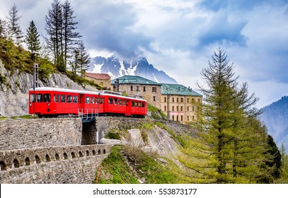 Red Train Going To Montenvers Mer De Glace Station Over Mont Blanc Massif In Chamonix,France