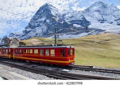 Red Train With Jungfrau Mountain, Switzerland