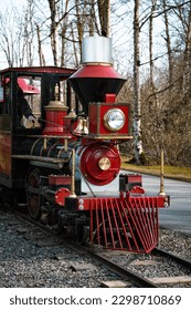 Red train moving down the tracks