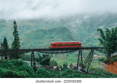 Red train while going to cable car to the top of the Fansipan mountain in Sapa town, Lao Cai, Vietnam