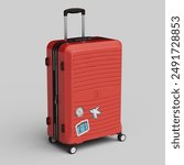 Red travelling suitcase with stickers on it