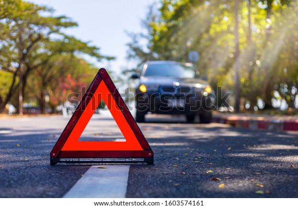 Red triangle, red emergency stop\
sign, red emergency symbol with  car stop and park on\
road.
