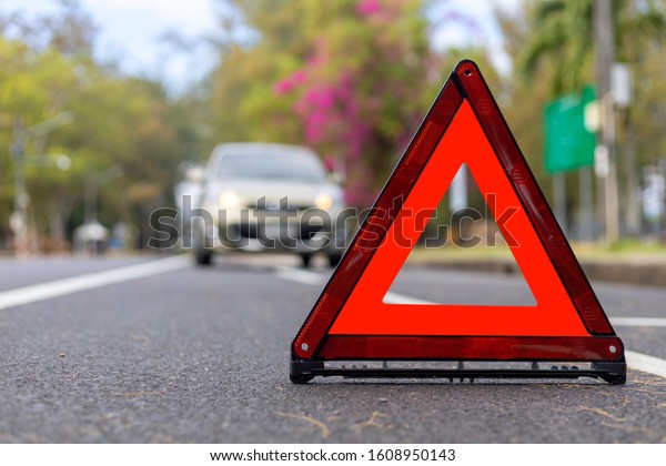 Red triangle, red emergency stop
sign, red emergency symbol and  car stop and park on
road.
