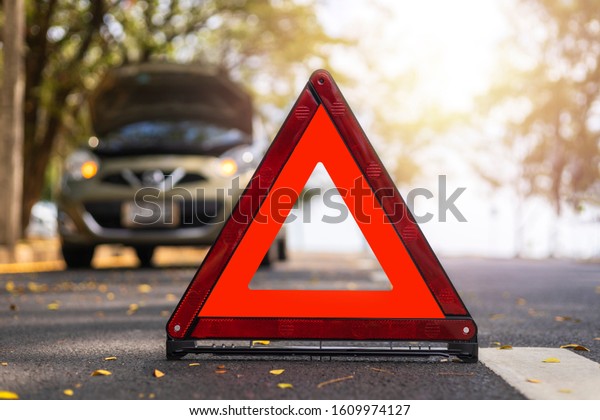 Red triangle, red emergency stop\
sign, red emergency symbol and  car stop and park on\
road.