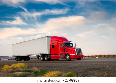 Red truck moving on a highway