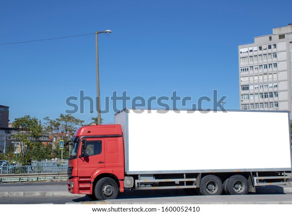 Red truck on the roadside. The back of the\
case is white. Suitable for\
advertising.