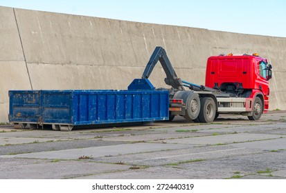 Red truck with a removable container.