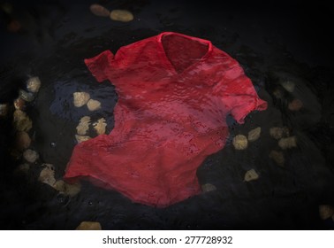 Red T-shirt Floating Or Sinking In Water