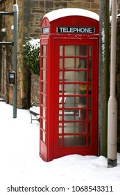 Red UK Village Telephone Box In The Snow