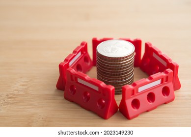 Red Under Construction Barrier Around Stacked Coins With Copy Space. Global World Economy Crisis, Repair, Fix, Revise Or Reset Investment Plan, Money Saving Management. Business And Financial Concept.