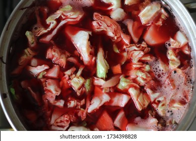 Red Vegetable Soup With Beets Cooked In A Pan On The Stove. Top Down View