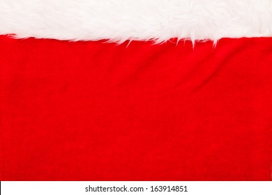 Red Velvet Background With White Fluffy Border Above 