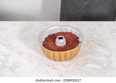 Red Velvet Cake Batter In A Bundt Cake Pan.