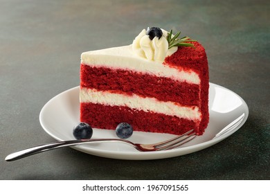 Red Velvet cake with blueberries on white plate over dark green background. - Powered by Shutterstock