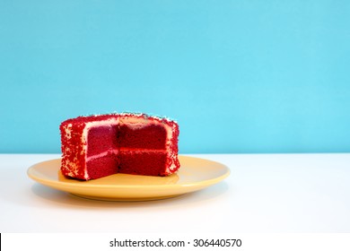 Red Velvet Cake On White Table And Blue Background