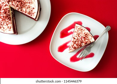 Red Velvet Cake Slice On Red Background. Top View