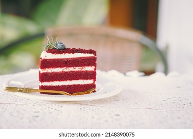 red velvet cream layer cake closeup on the cafe table, desser food sweet delicious vintage tone