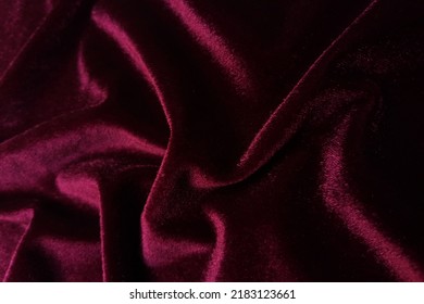 Red velvet crumpled or wavy fabric texture background. Abstract linen cloth soft waves. Merino yarn. Smooth elegant luxury cloth texture. Concept for banner or advertisement. - Shutterstock ID 2183123661