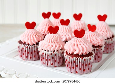 Red velvet cupcakes with red hearts for Valentine's day