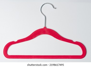 Red Velvet Dress Hanger Isolated On White Studio Background