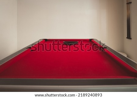 Red velvet empty pool table