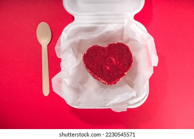 Red velvet heart shaped Valentine day bento cake, sweet dessert surprise gift for Valentines top view, with roses, champagne
