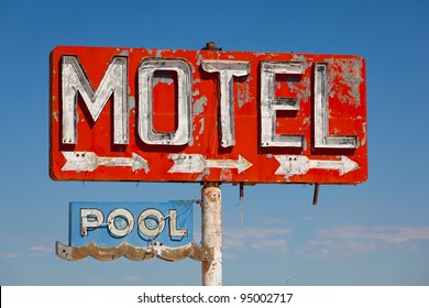 Red, Vintage, Neon Motel Sign On Blue Sky