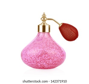 Red vintage perfume bottle with atomizer isolated on white background.