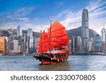 Red vintage sailboat for tourist pass from Hong king city side to kowloon city, Hongkong icon for travel, China